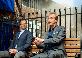 Jonny Lee Miller and Rhys Ifans as Sherlock Holmes and Mycroft Holmes in CBS Elementary Season 2 Episode 1 Step Nine