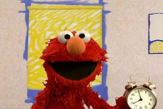 Elmo wakes up the shade using an alarm clock. Sesame Street Elmo's World Sleep The Noodle Family