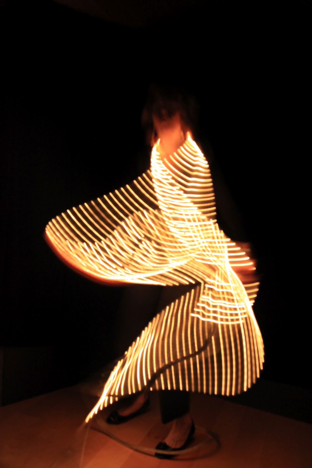 curving back weaving strands of light