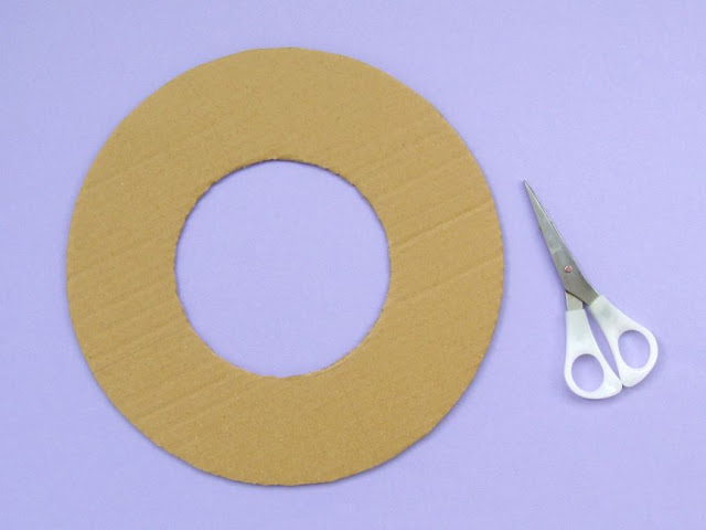 DIY Upcycled Sewing Thread Reels Wreath Tutorial cut out the wreath shape from strong card