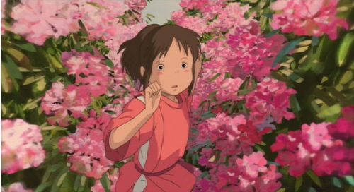 Chihiro running through a garden in Spirited Away 2001 animatedfilmreviews.filminspector.com