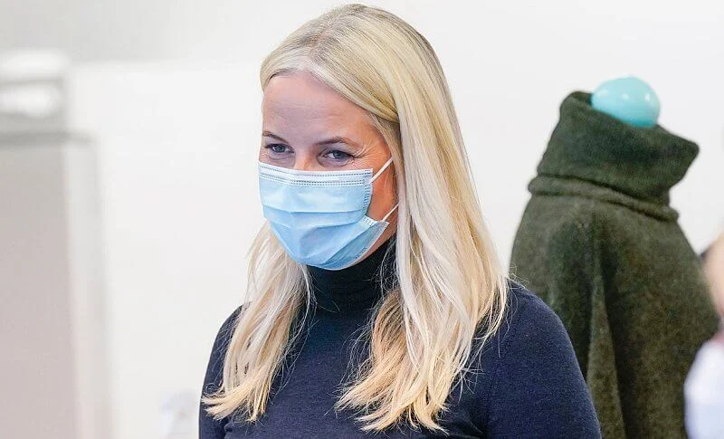 Crown Princess Mette-Marit wore a navy high-neck wool sweater and grey trousers