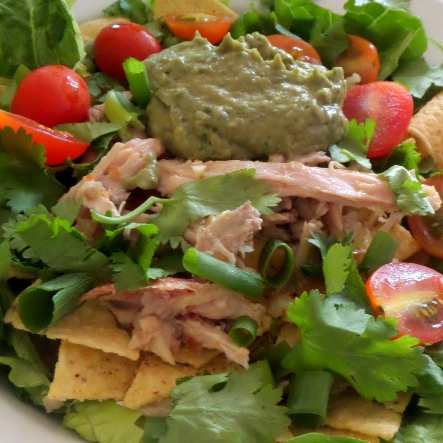 Tequila Lime Chicken Taco Salad:  Left over rotisserie chicken,  shredded,  marinated in tequila and lime juice topping green lettuce and tortilla chips.