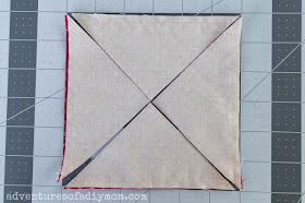 image depicting cuts through fabric diagonally from corner to corner in both directions
