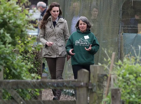 Kate Middleton wore Troy London Wax Parka, Jigsaw Cashmere Jumper, Zara Trousers, Penelope Chilvers boot, Kiki Lauren Earrings