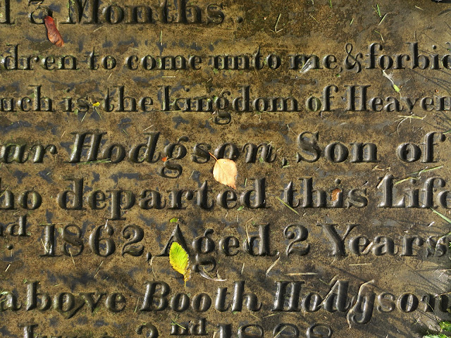Autumn leaves on grave. External remains of the old St Paul's Church, King Cross, Halifax. November 2nd 2021