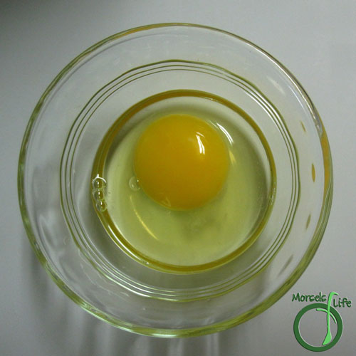 Morsels of Life - How to Poach an Egg Step 2 - Crack egg into a small bowl or ramekin.
