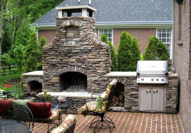 covered outdoor living spaces with fireplace