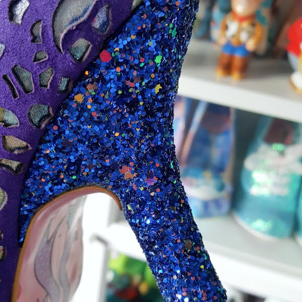 close up of blue glitter heel on ankle boot