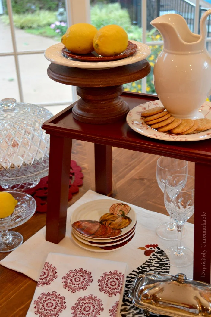 Fall Table Entertaining with red wooden table riser and tableware