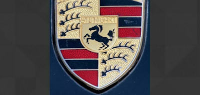 Q 28. What luxury car brand does this logo represent?