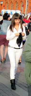 Girl in white tight jeans on the street