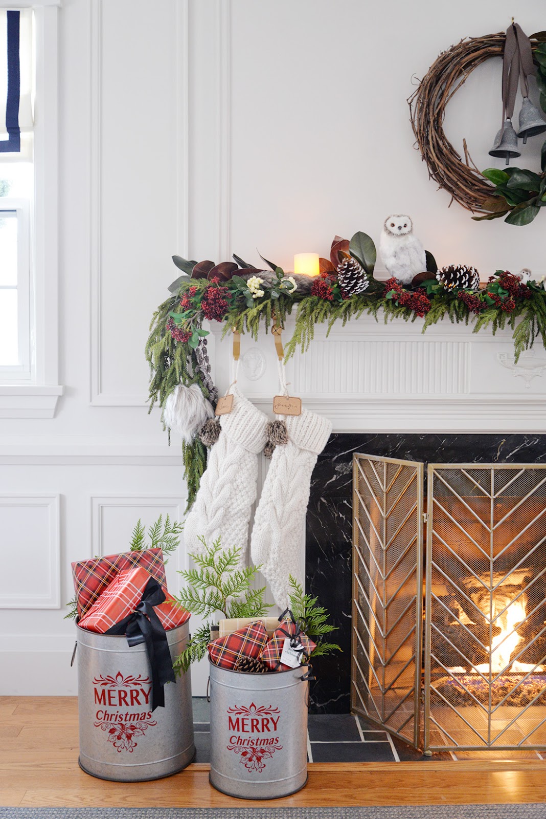 Faux cedar garland. Red and white christmas decorations. Vine and magnolia wreath. Cable knit stockings.