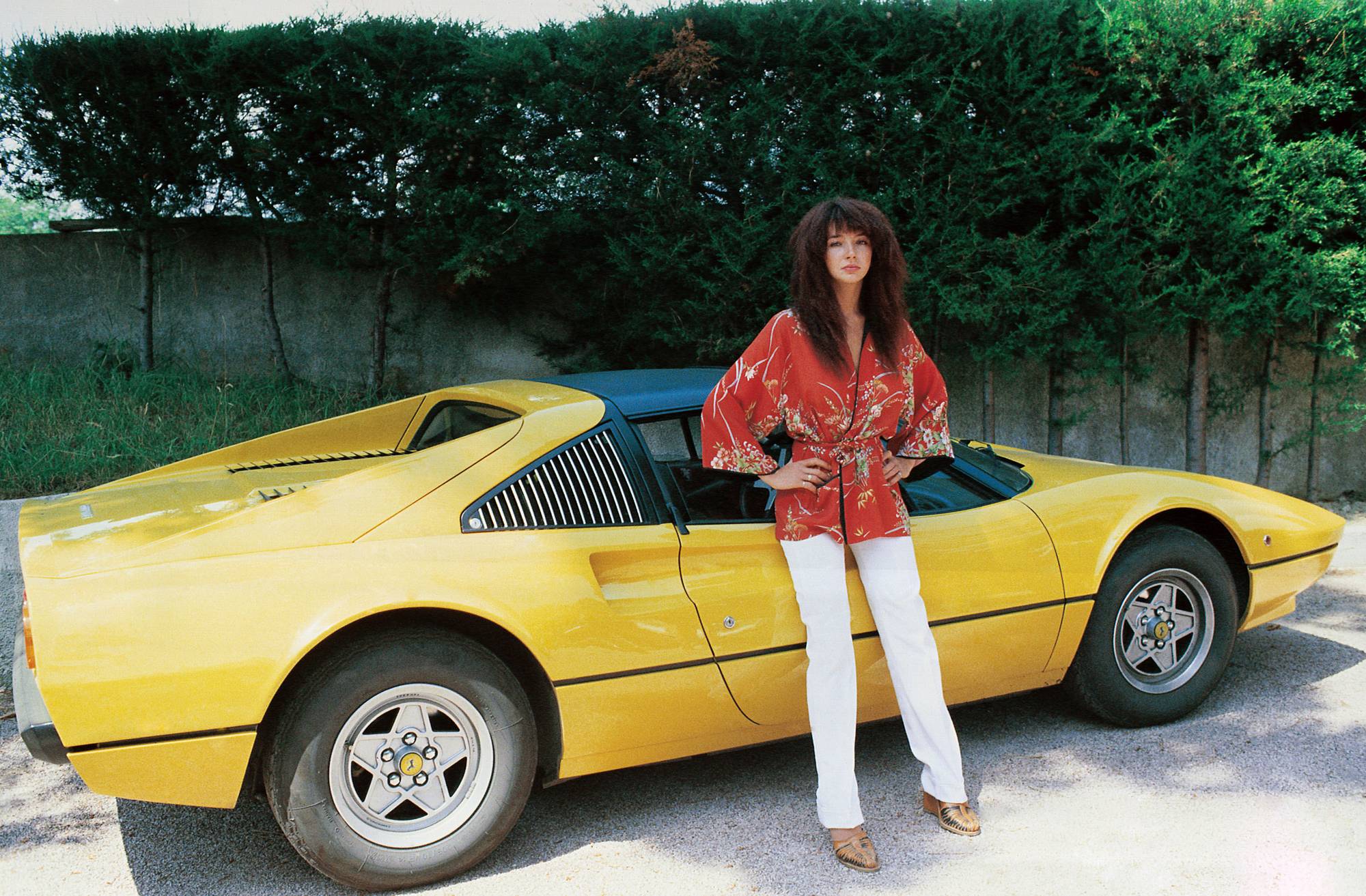 Kate Bush With a Yellow Ferrari in Italy, 1978 ~ Vintage Everyday