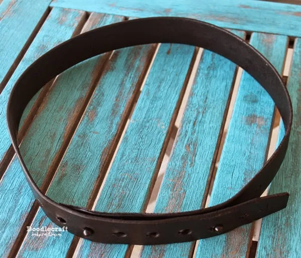 leather belt with 2 studs instead of a traditional buckle