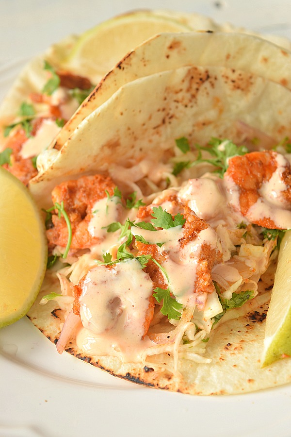 spicy shrimp tacos with  cabbage cilantro slaw