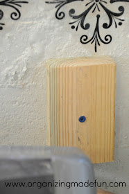 Cement screws in wood blocks in the wall | OrganizingMadeFun.com
