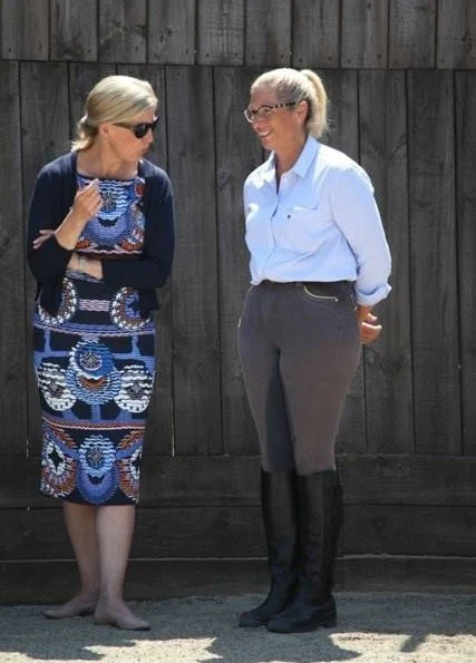 The Countess of Wessex wore a Body Con Reptile Moth Print Jersey Dress by Alexander Mcqueen while visiting the Mendip School and Gianvito Rossi pumps