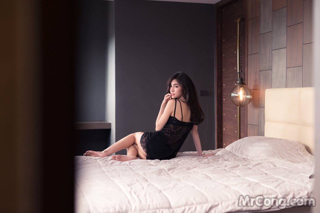 Beautiful Jarunan Tavepanya lazing in bed with a black lace nightgown (12 photos)
