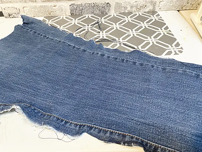 leg of blue jeans cut into a rectangel