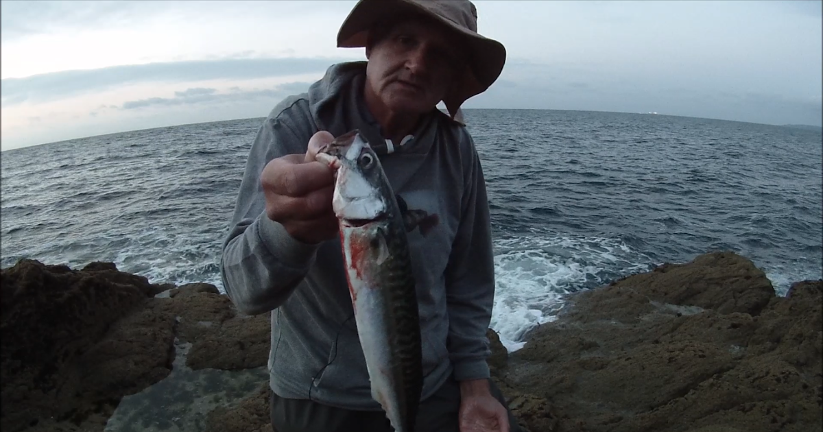 Cornish Shore and Kayak Fisherman Shore Lure Fishing from the Rocks