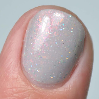 grey shimmer nail polish close up swatch