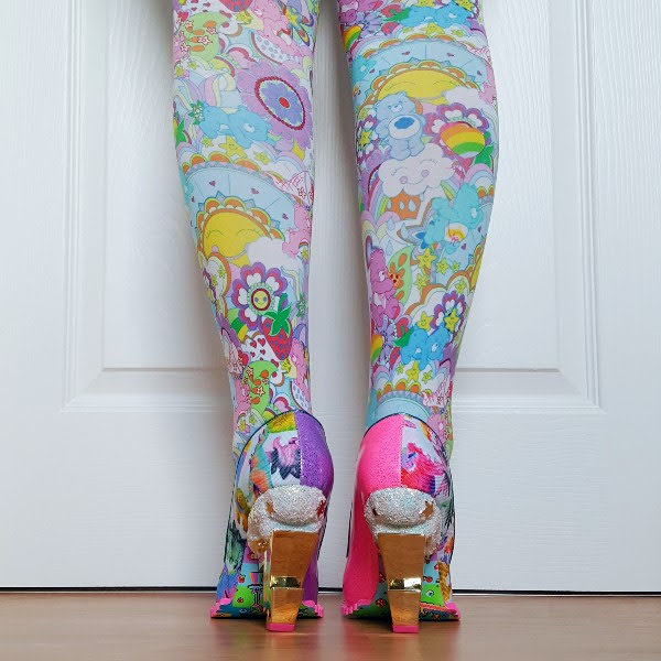 back of legs wearing Care Bears tights and lightning bolt heel shoes