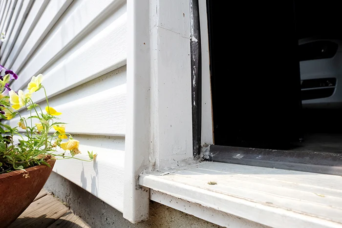 finished door stop framing patch on garage man door