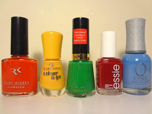 fuzzy navel by ruby kisses, little miss sunrise by essence, posh by revlon, a list by essie, and snowcone by orly, nail polish