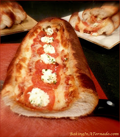Pizza Party Boat is fun to share, an Italian loaf stuffed with pizza ingredients. Bake, slice and share | Recipe developed by www.BakingInATornado.com | #recipe #snack