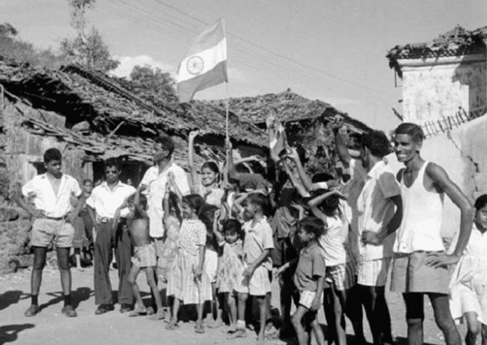 Locals celebrating with the Indian flag in Dadra and Nagar Haveli, image via The Better India