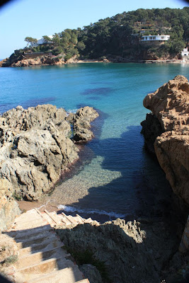 Clear water of Sa Riera beach in La Costa Brava