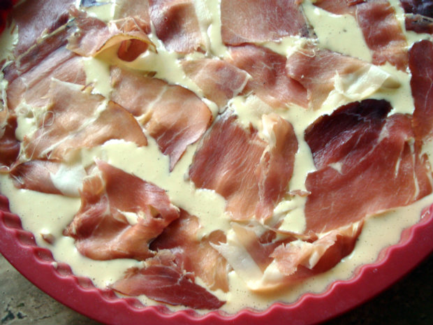 top the batter with pieces of prosciutto.