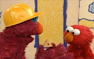 Telly presents a small wooden triangle. Elmo says it is a terrific triangle building. Sesame Street Elmo's World Building Things