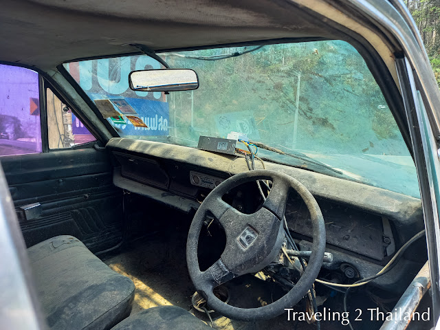 Old police car along route 11 in Thailand Traveling in Thailand