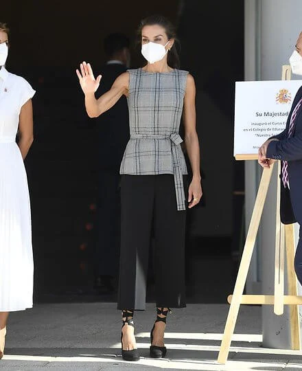 Queen Letizia wore a plaid belted top from Zara and Letizia wore Castaner black Carina ankle tie wedge, and black Hugo Boss cropped wide leg trousers