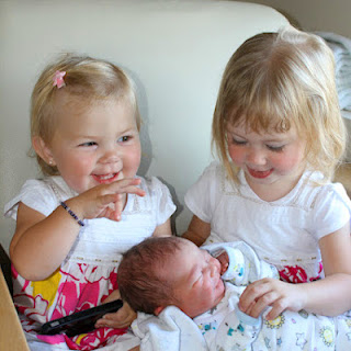 photo of baby paul benjamin with lucy and helen