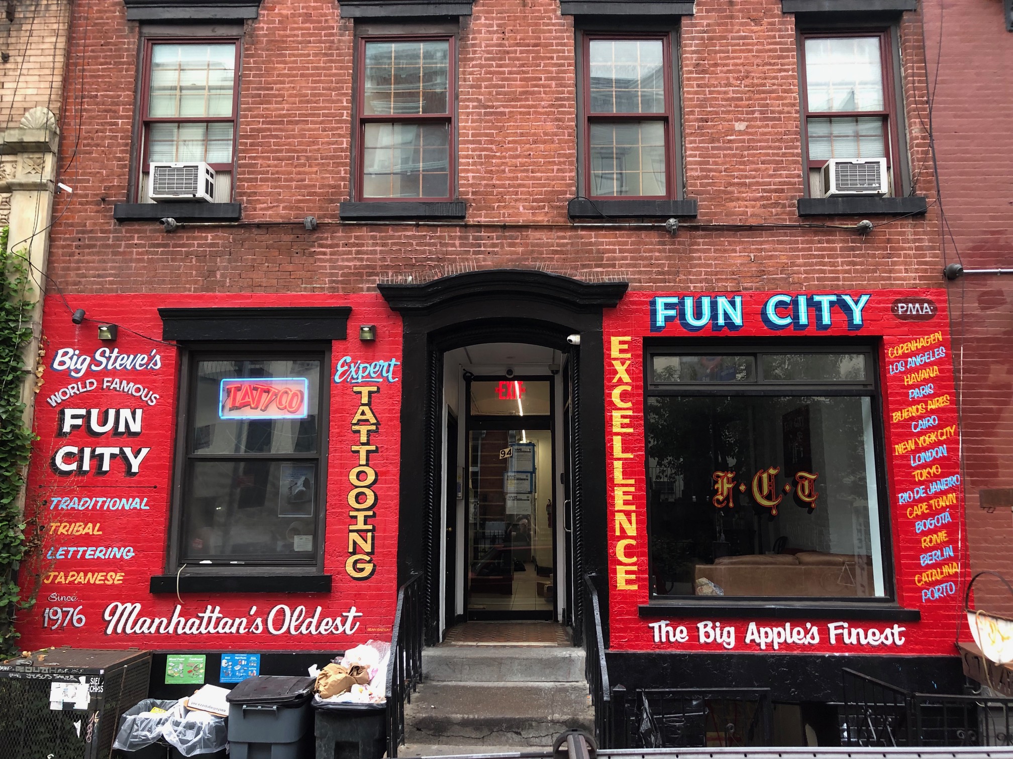 Portrait red painted entrance Fun City Tattooing basement brick tenement  building 94 StMarks Place East Village New York Stock Photo  Alamy