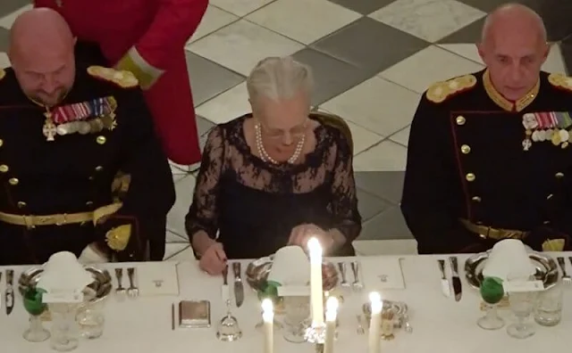 Crown Princess Mary wore the official uniform worn by Danish female navy officers. Queen Margrethe wore a lace tulle gown