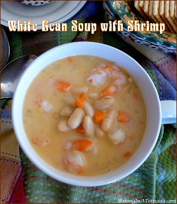 White Bean Soup with Shrimp is a warm hearty cold weather dinner. This soup comes together in one large pot in less than an hour. | Recipe developed by www.BakingInATornado.com | #recipe #dinner