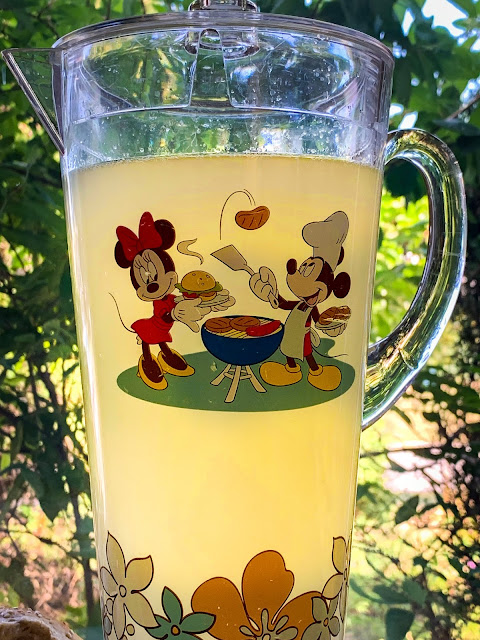 Mickey and Minnie are grilling on this summer pitcher.