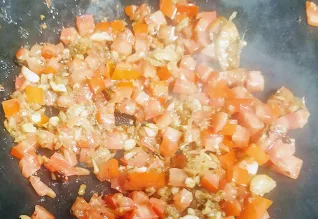 Sauteing tomatoes ginger garlic for chicken manchow soup recipe