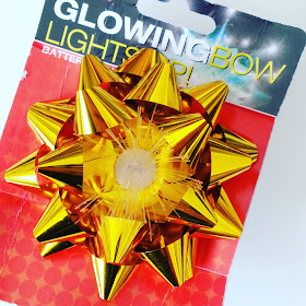 'Glowing' gift bow in packaging.