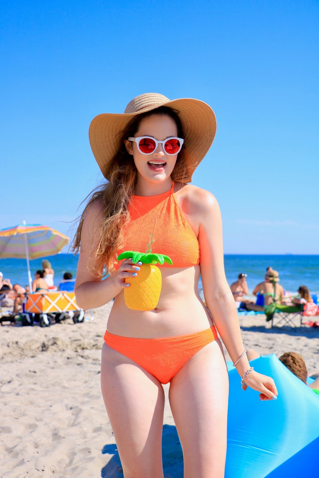 Fashion blogger Kathleen Harper in a bikini with pineapple cup