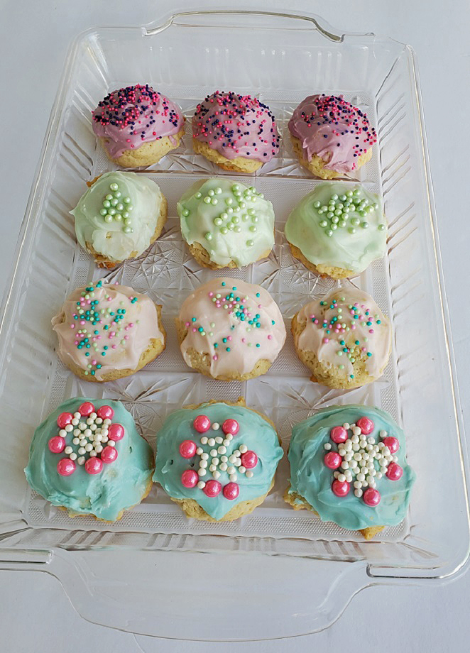 these are purple green pink and blue frosted Italian Wedding tray vanilla and almond flavored Cookies