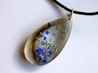 Colourful teardrop shaped pendant for a lock of hair