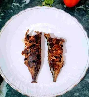 Serving two crisp fish fry in a serving plate for fish fry recipe