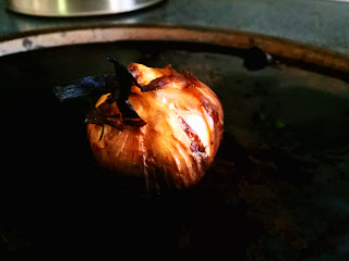 garlic on cooking sheet after roasting by artist Rickbischoff