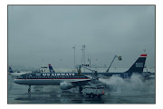 . traveling through gray, rainy and rather shabby LaGuardia Airport. (usairdeice)