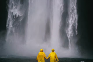 couple in front of waterfall